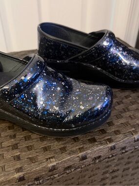 Dansko Glitter Slip-On Clogs in Black with Blue and Silver Speckles